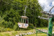 Abbremsen an der Katrin-Seilbahn - Die Einseilumlaufbahn hat eine Streckenlänge von 2.490 Metern. Während der Fahrt legst Du 941 Höhenmeter zurück und bist knapp 12 Minuten unterwegs. • © alpintreff.de - Christian Schön