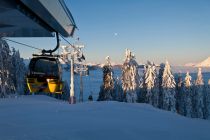 Die gelben Kabinen der Sinalcobahn im Skigebiet Hochkönig sind mit gleichnamiger Werbung ausgestattet. • © Ski Amade