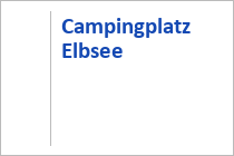 Unten mittig liegt der Campingplatz, davor das Strandbad. • © Weissensee Information