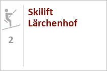 Logo des Lärchenhof-Resorts. Der Skilift liegt direkt am Hotel. • © Der Lärchenhof